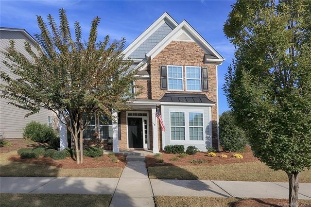 Pops of fall color add curb appeal to greet guests
