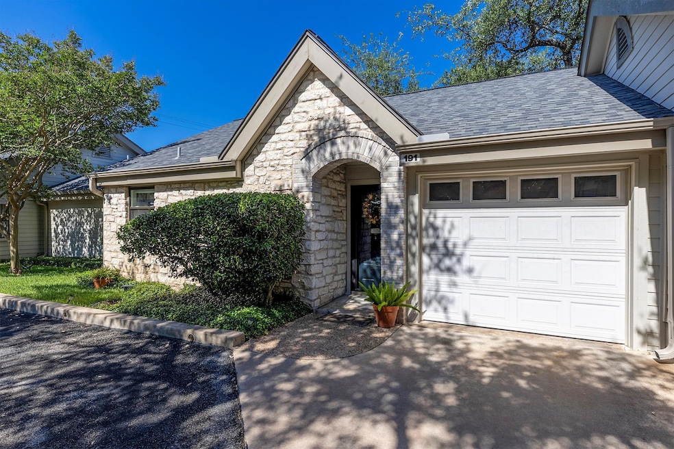 View of front of home featuring stone siding, asp