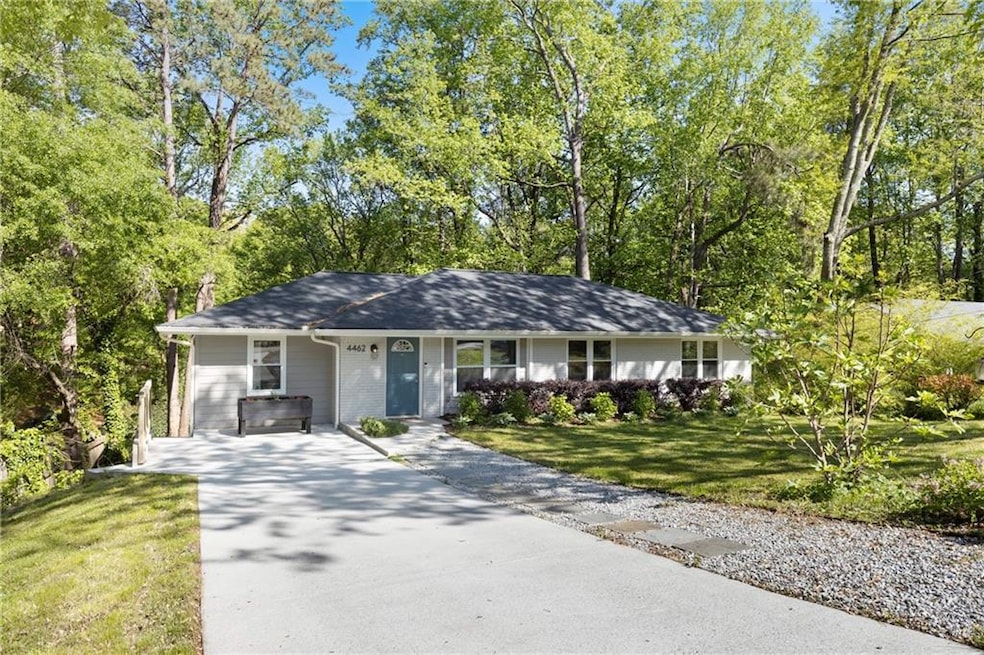 Single story home with concrete driveway and a fro