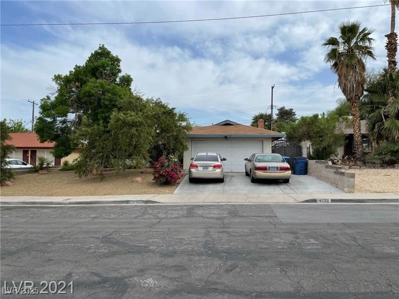 View of front of house featuring concrete driveway