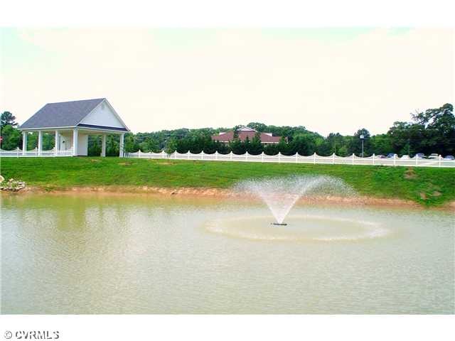 Exterior Front - This house faces the Fountain Pon