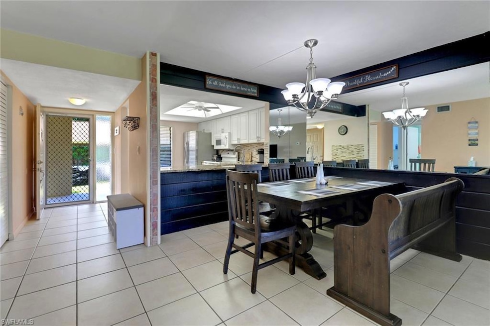Dining area with light tile patterned floors, and 