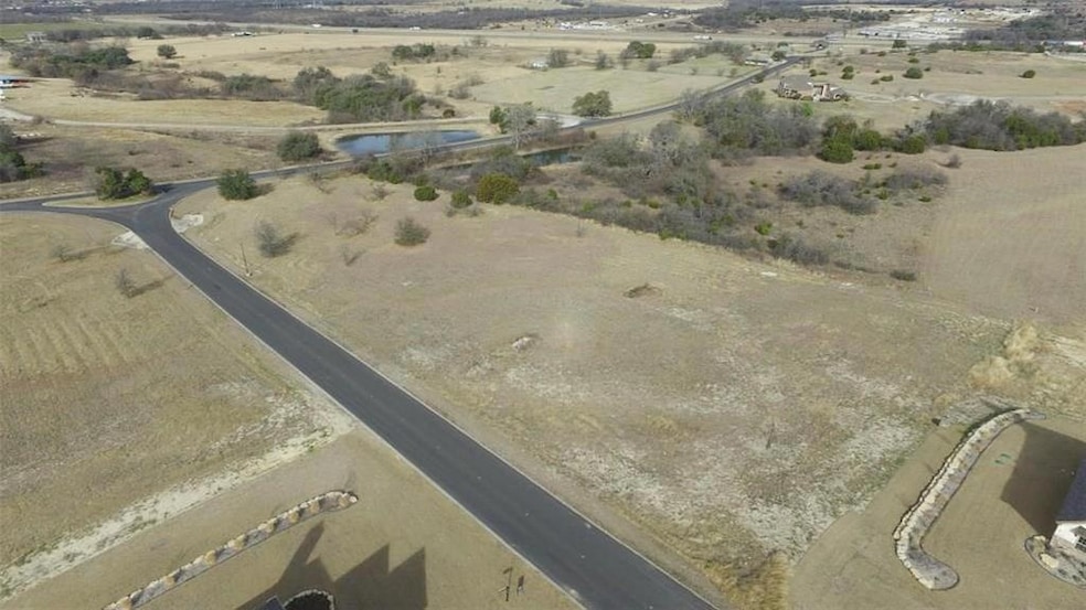 The lot is to the left of the home you can see. Th