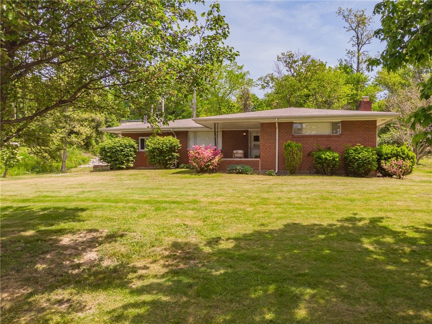 This cute brick ranch sits waiting for the next ge