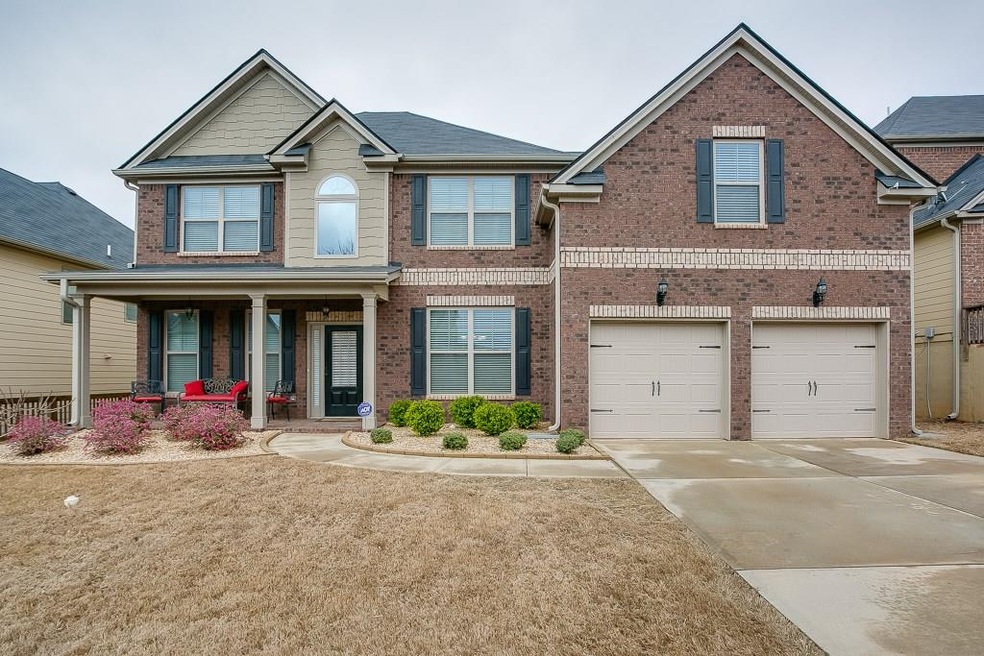 Exterior of this home features low maintenance lan