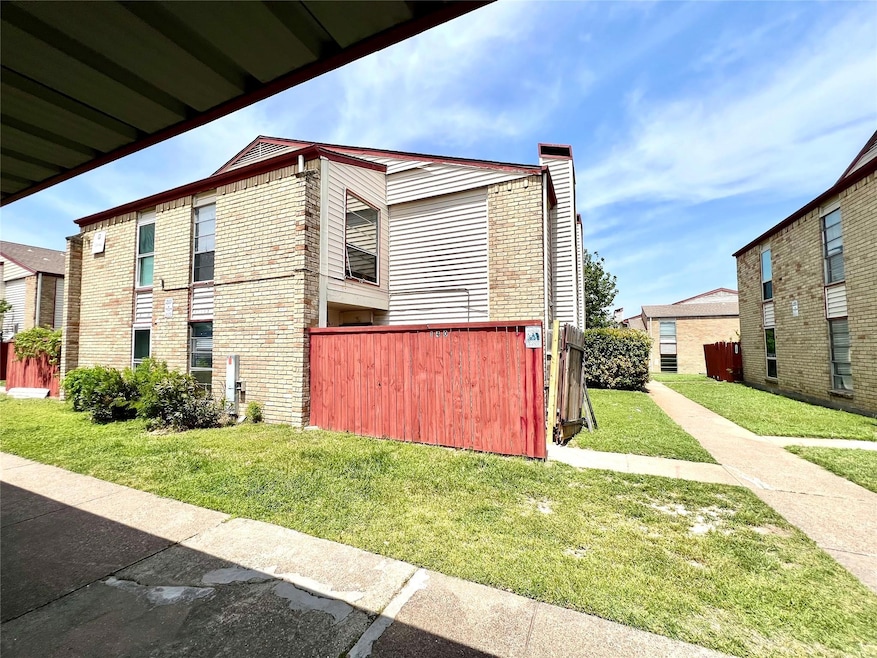 View of home's exterior with a lawn, a chimney, an
