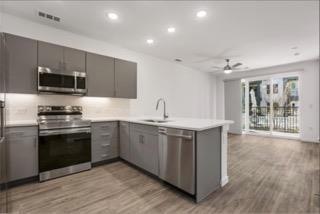 Kitchen featuring stainless steel appliances, gra