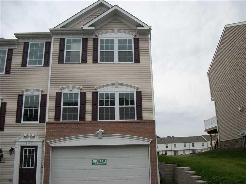 Exterior Front. End Unit with 2 Car Garage