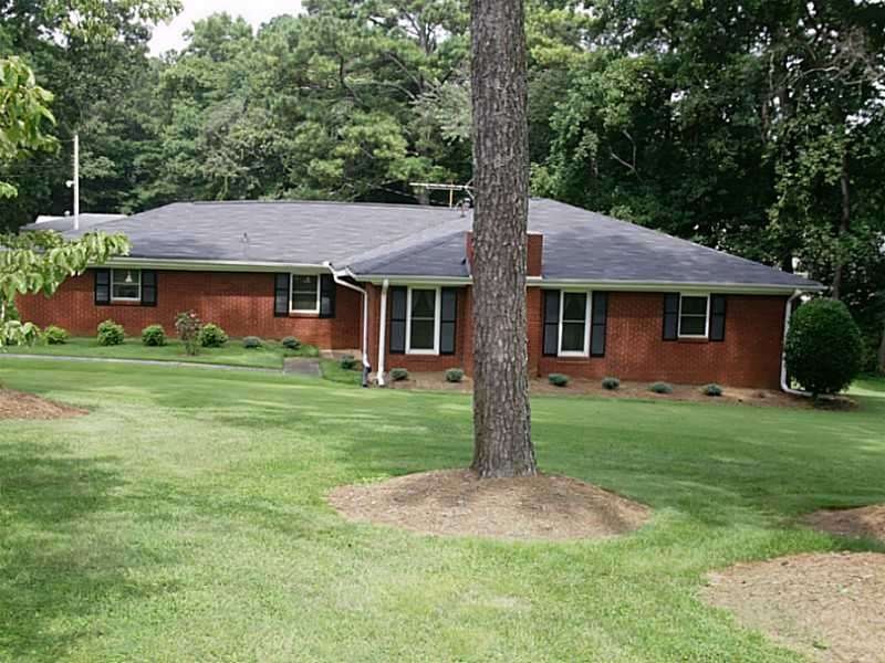 Exterior Front. The house sets back off the main r