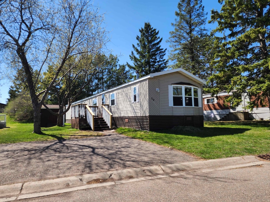 View of front of property featuring a front lawn a