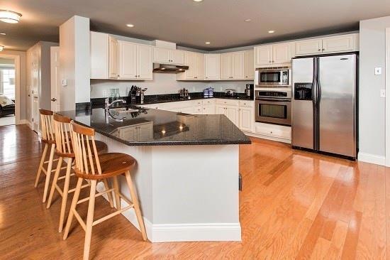 Spacious gourmet kitchen with top of...