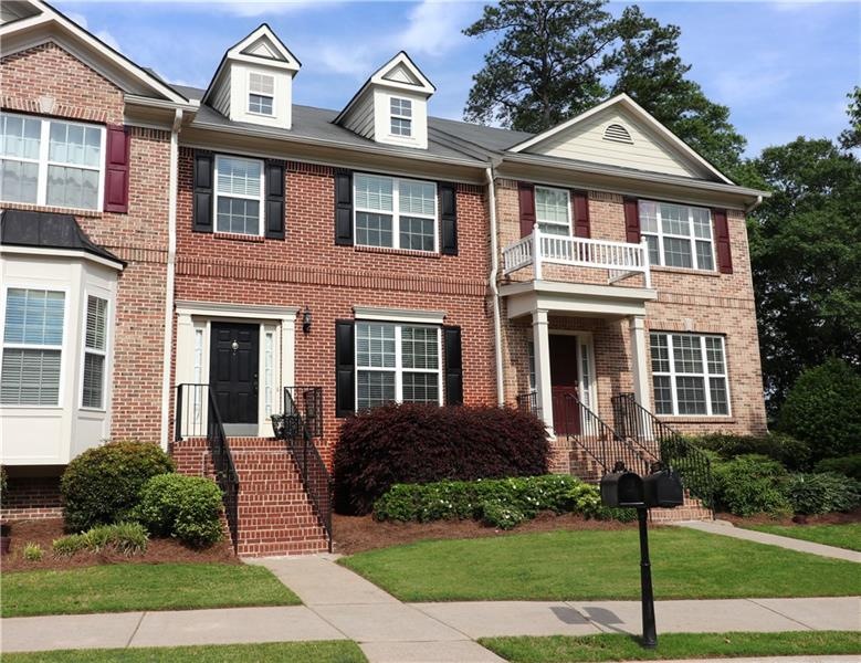 Beautiful brick home with a front porch leading to