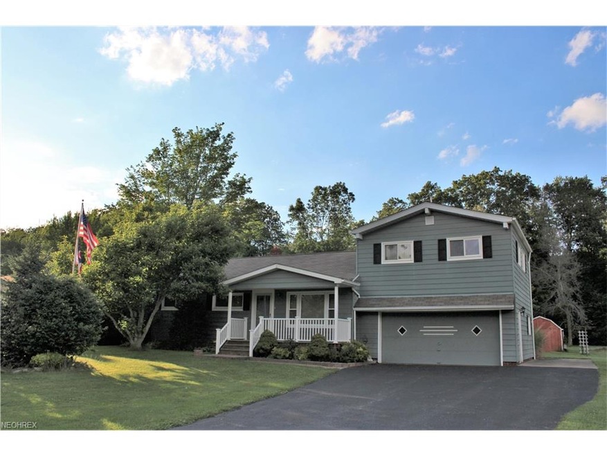 Welcome to 8370 Sharp Lane in Chesterland. Front P