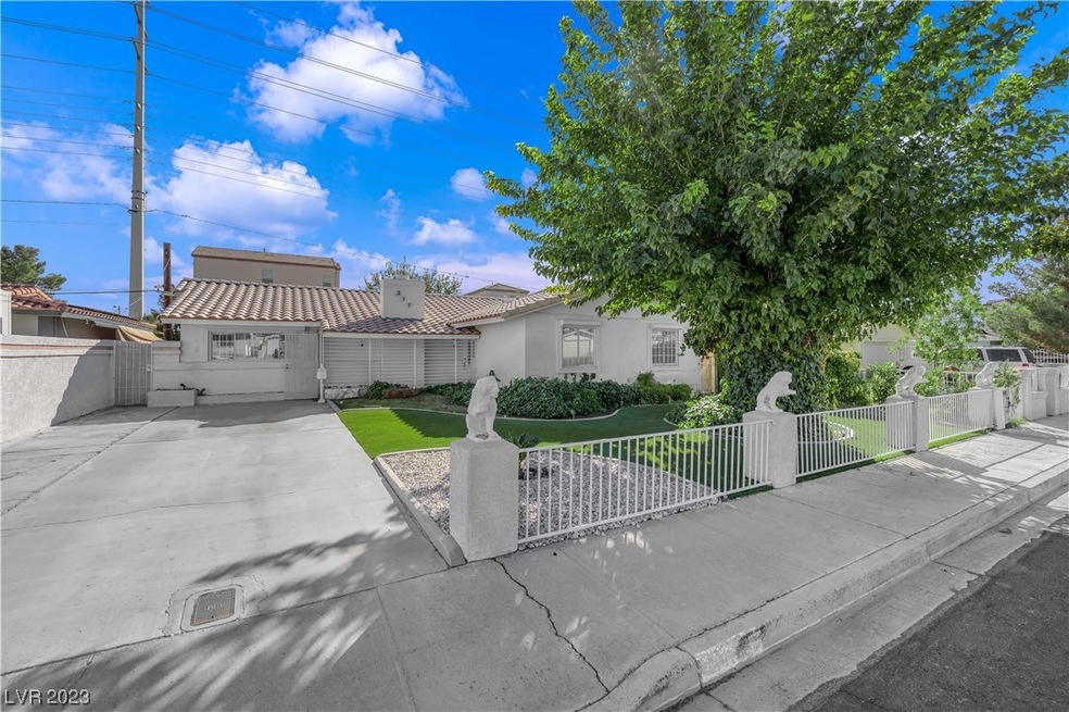Extended driveway & mature landscaping.