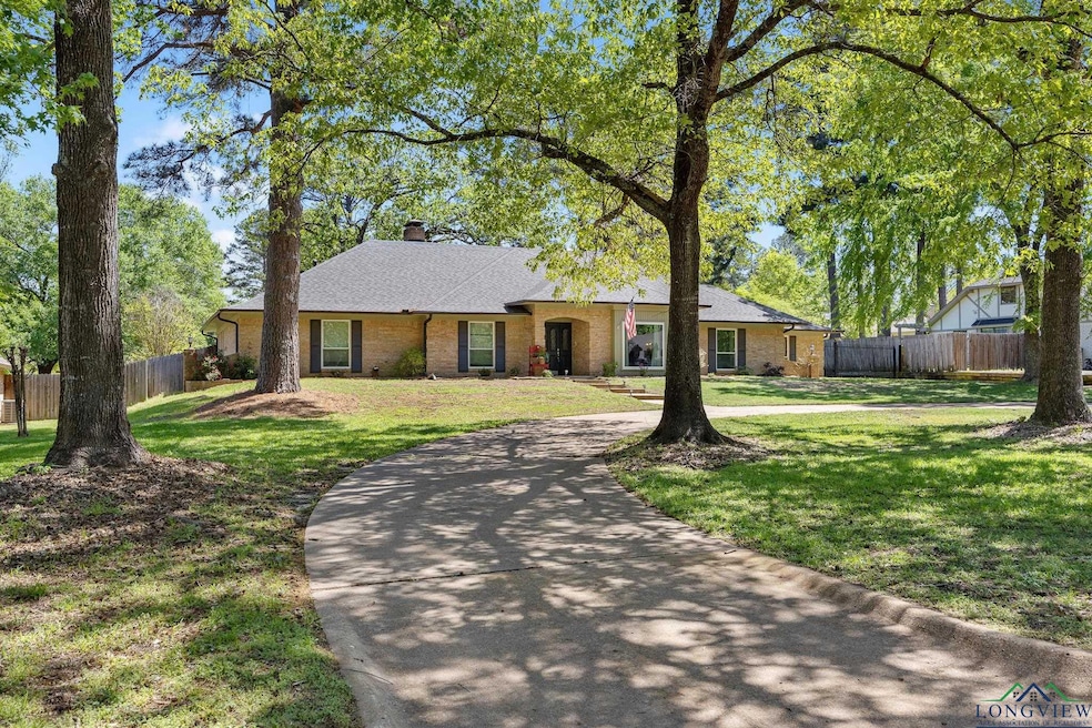 Ranch-style house featuring a front yard, brick si