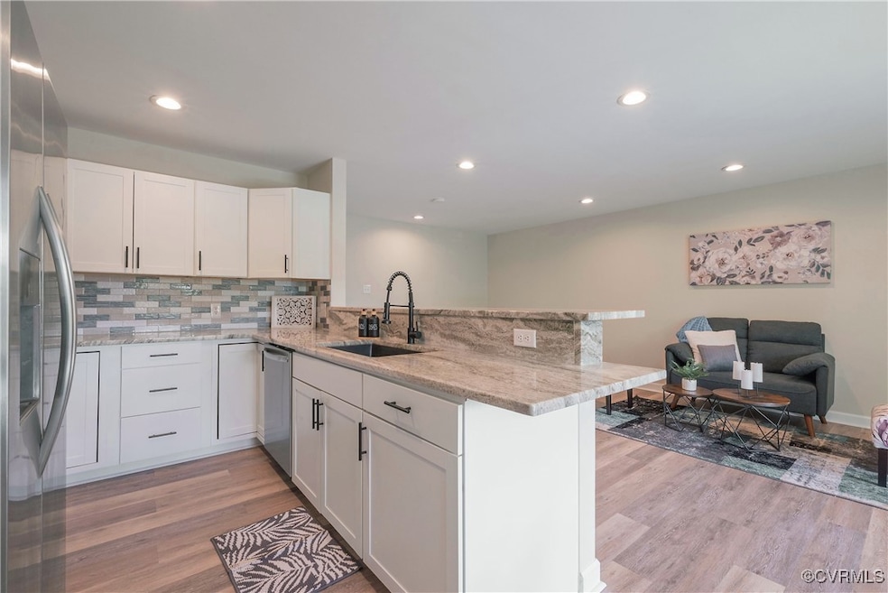 Kitchen featuring a sink, stainless steel applianc