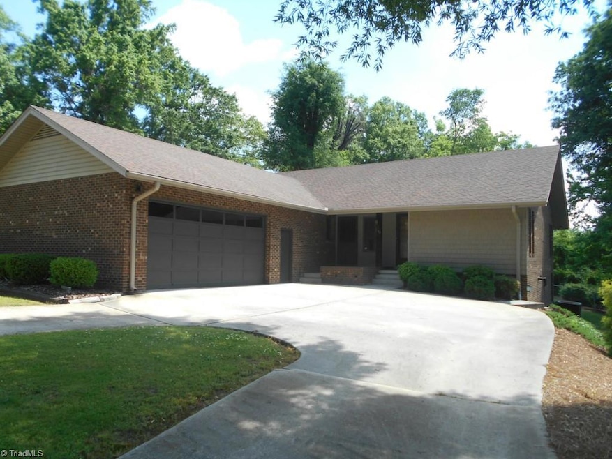 Circle drive for easy turn around and attached over-sized garage that is conditioned and built in cabinets.