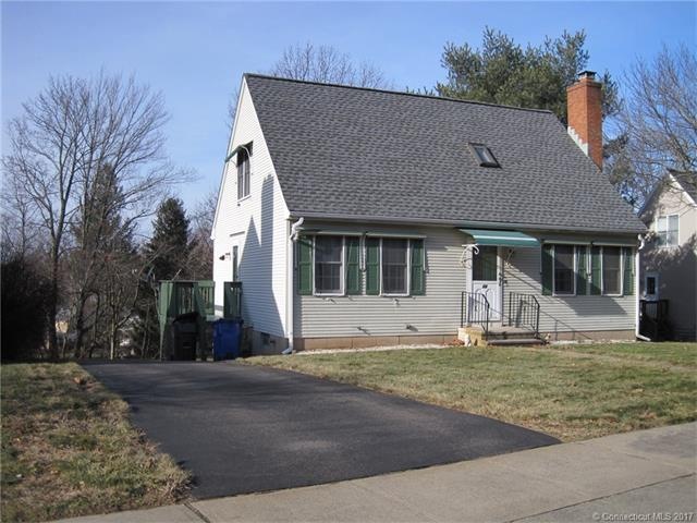 Driveway wraps around to garage & private yard.  R