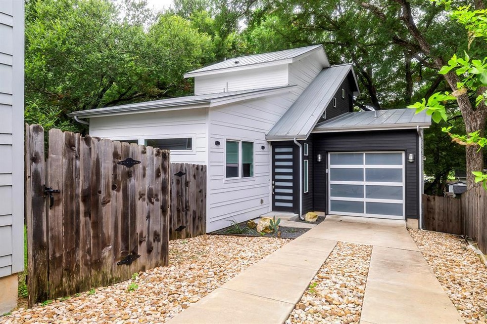 View of front of property featuring concrete driv