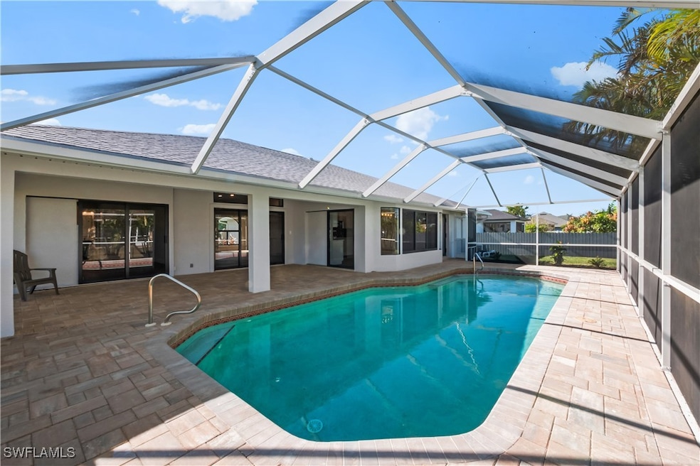 View of swimming pool featuring a lanai, a patio a
