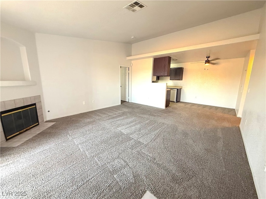 Unfurnished living room featuring light carpet, a