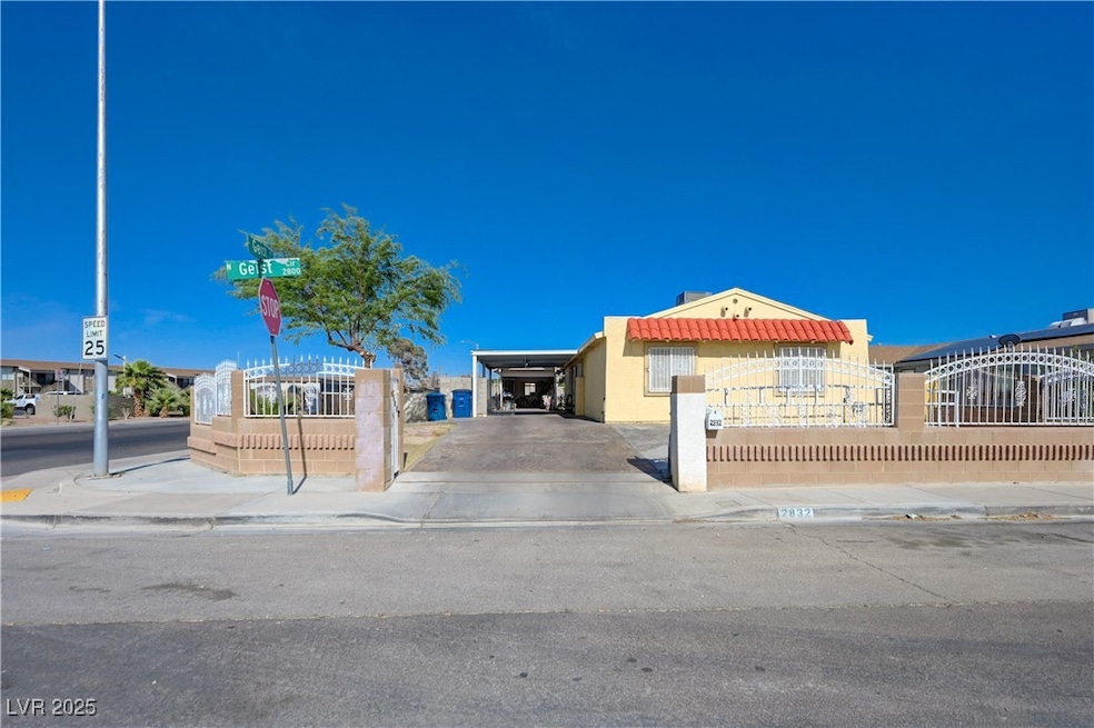 View of front facade featuring a carport, stucco s