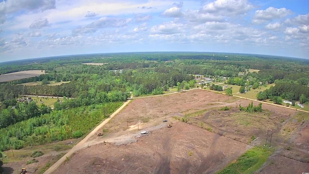View of property location featuring a heavily wooded area