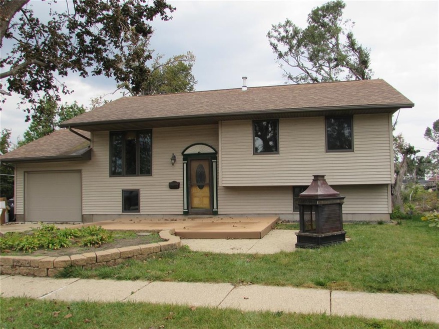 Front exterior view with inviting front deck.