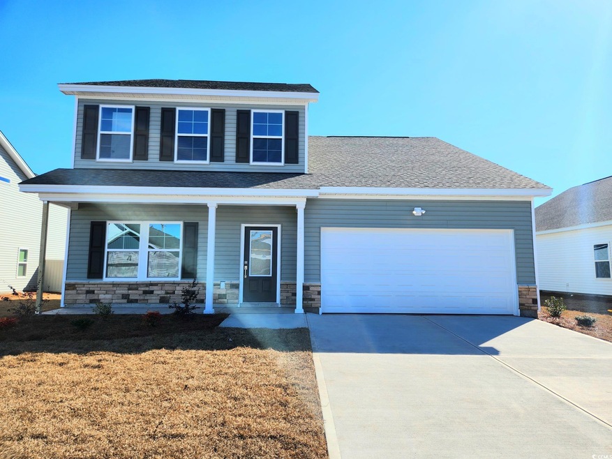 Front facade featuring a garage and a porch