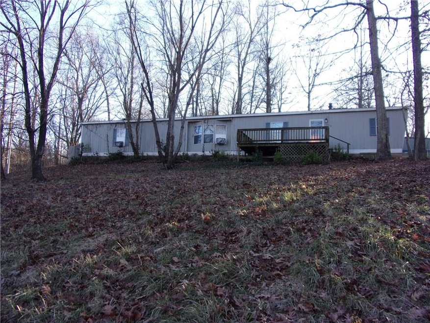 1994 single wide, 2bed, 2 bath home on 1.51 acres. Weatherization completed Jan 2018.  Fridge, washer and dryer convey.  Newer Roof, ready to carpet and paint. Great view, corner lot, private.  Large 16ft x 12ft front deck to enjoy the view