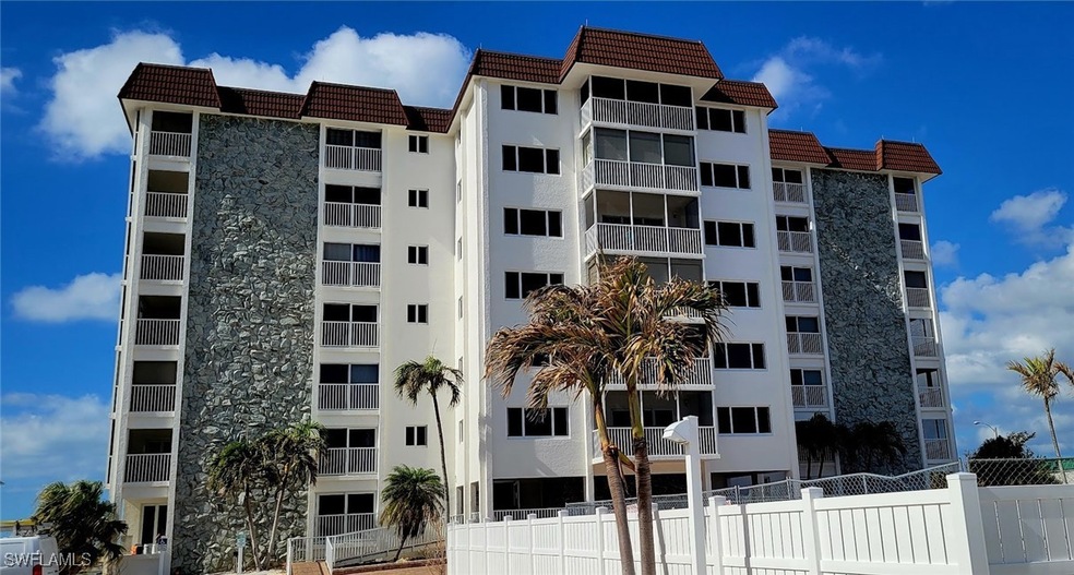 View of property featuring fence