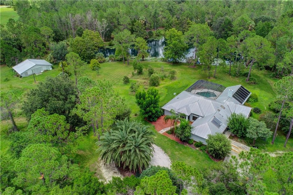 Aerial View of Large Beautiful Home with Large Poo