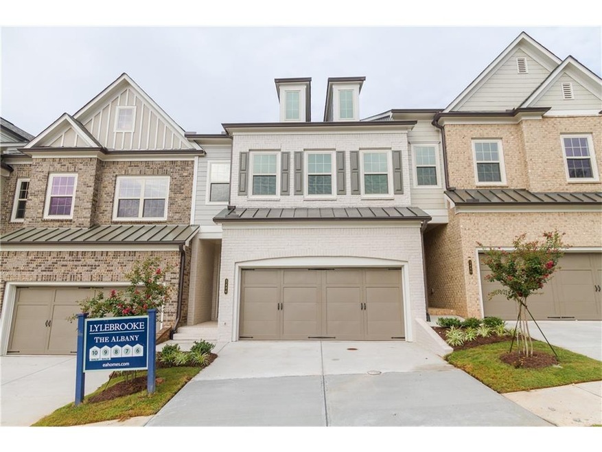 Homesite 7 has a painted brick and Hardie exterior