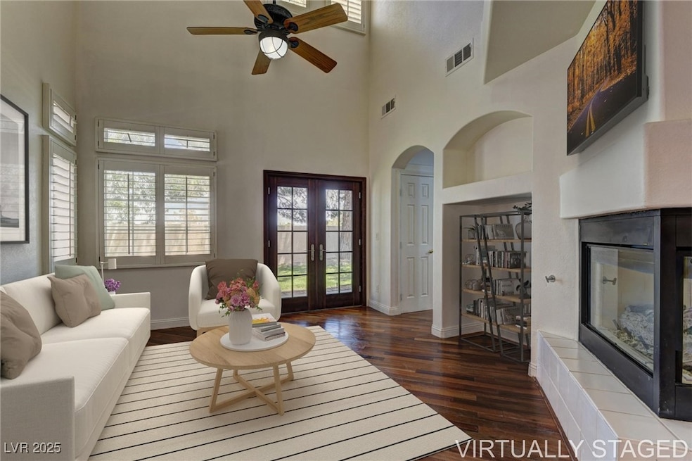 Virtually Staged; Living area with a multi sided f