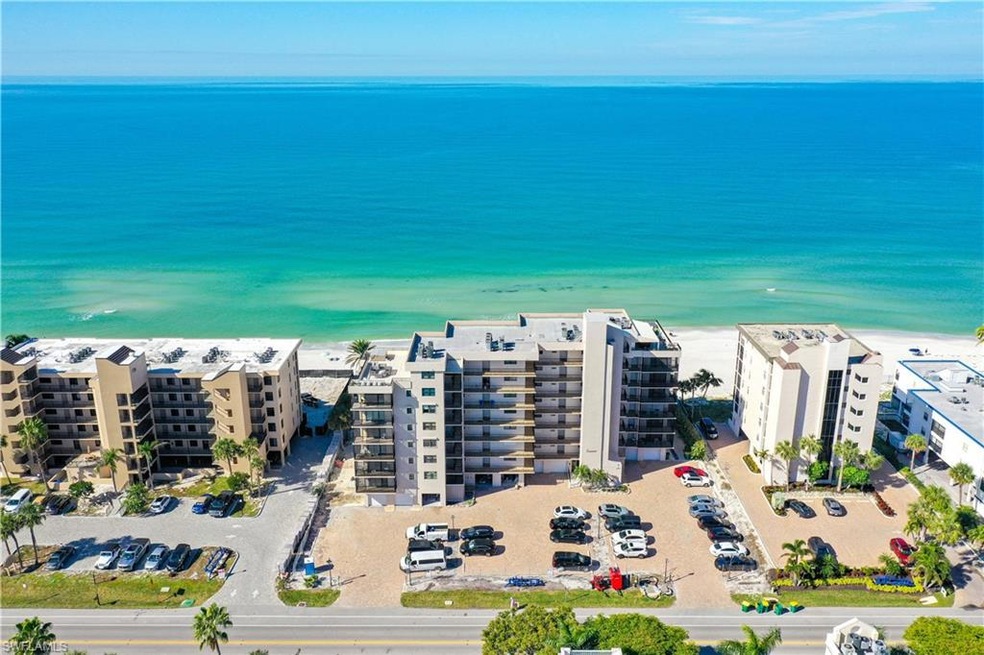 Drone / aerial view featuring a beach view and a w