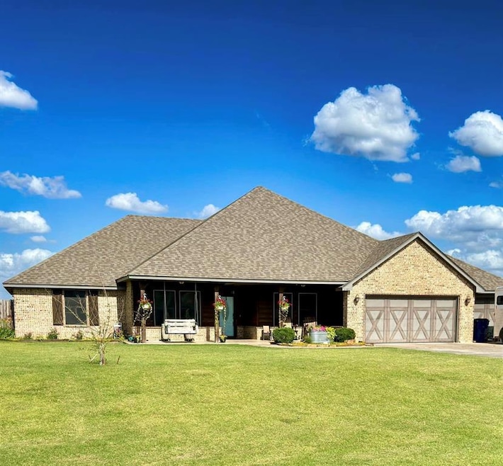 View of front of property with a front lawn and a 