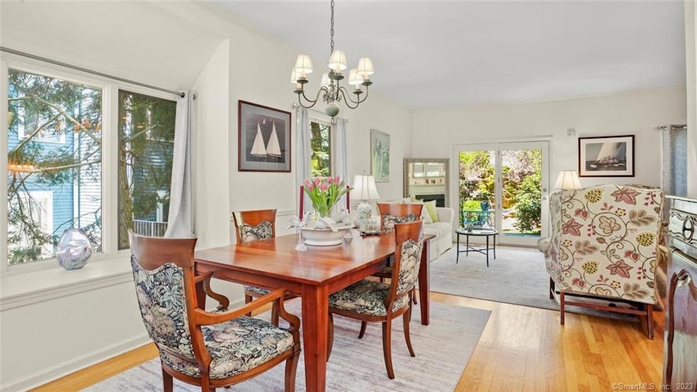The main level dining area & living room leads to 