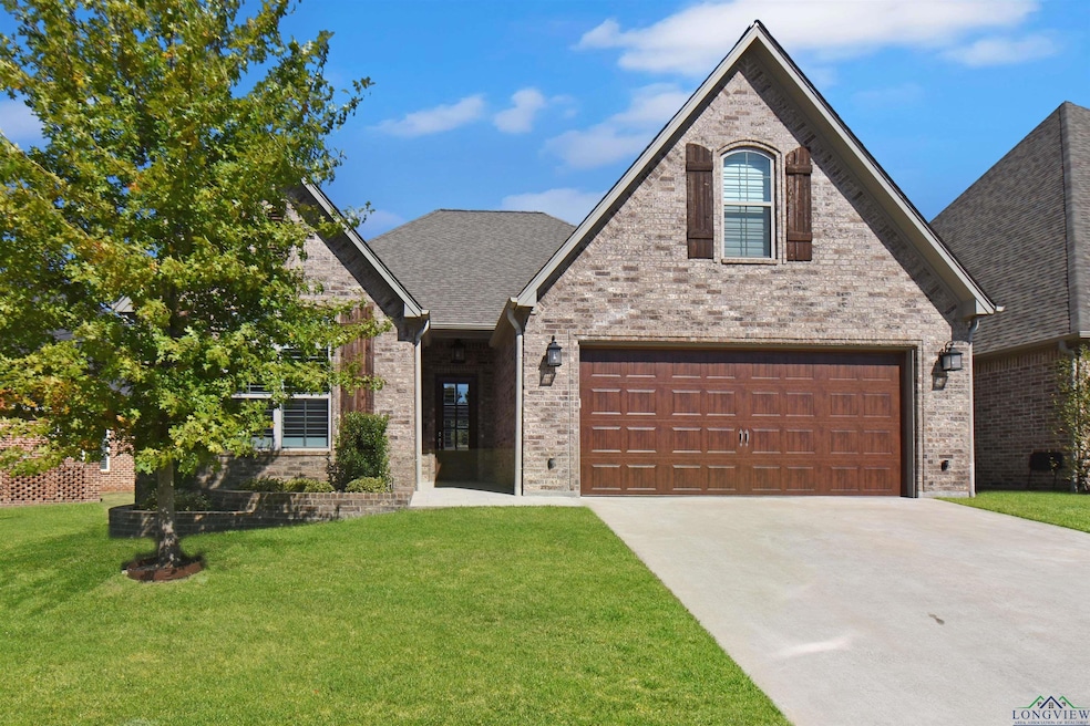 View of front of home featuring a front lawn