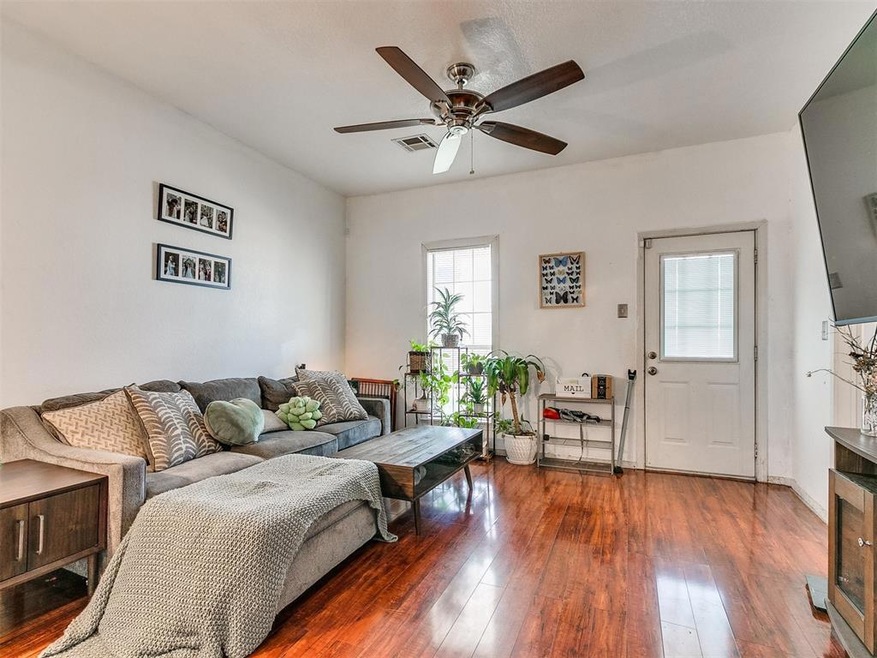 Living room with luxury plank flooring anda  ceili
