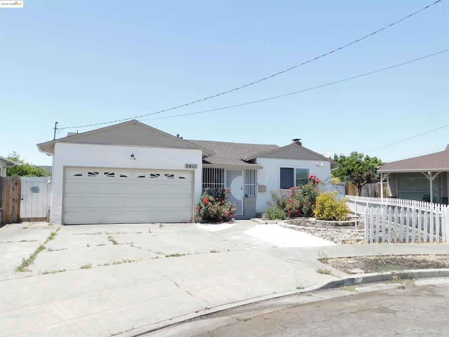 Ranch-style house featuring concrete driveway, stucco siding, and an attached garage