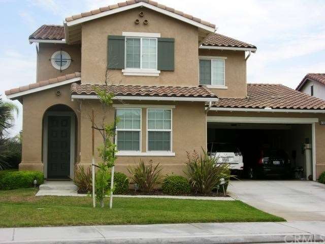 Home offers a three car tandem garage with epoxy f