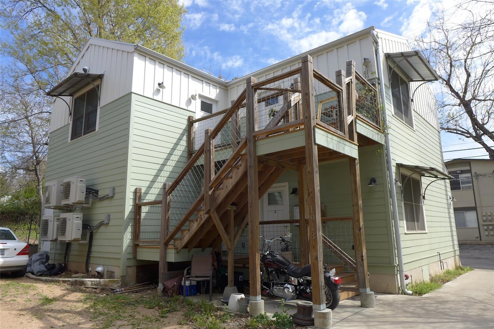 Rear view of house with board and batten siding, 