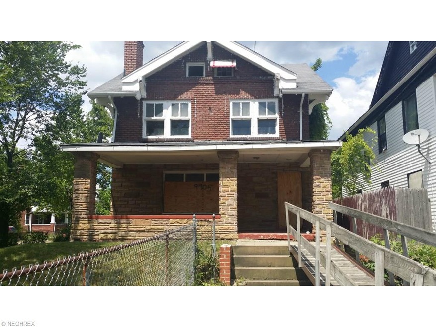 Handicap accessible ramp leading to large brick co