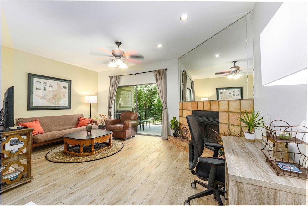 Home office with ceiling fan, light wood finished