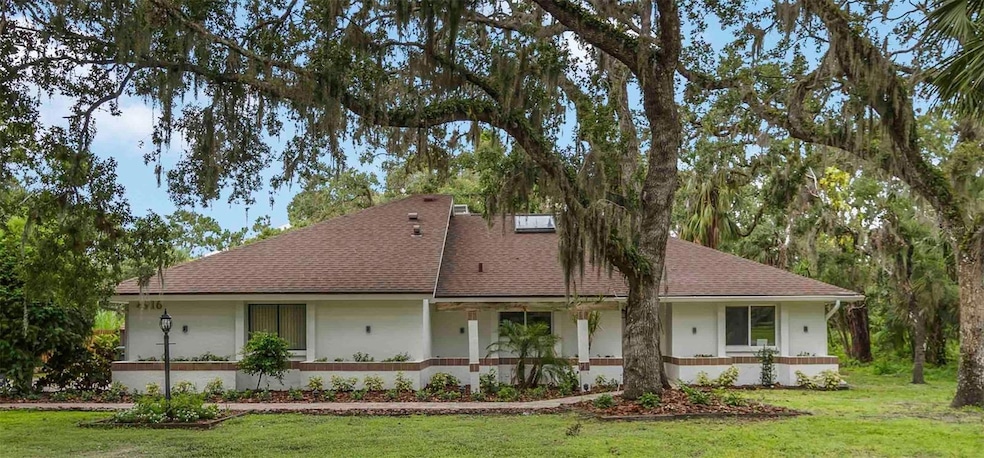 4916 Hidden Oaks Trail, Sarasota, FL 34232 - photo 1