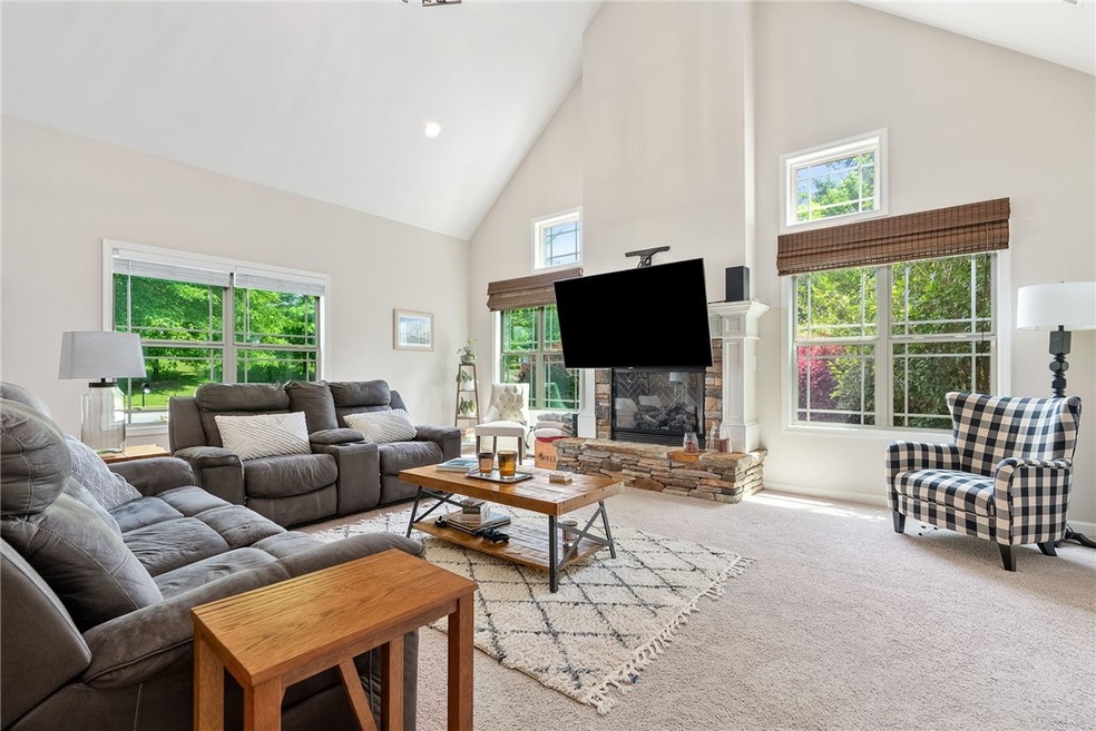 Sunny great room with lots of windows and beautifu