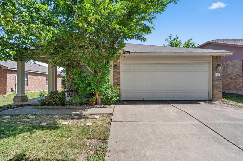 View of front facade featuring concrete driveway 