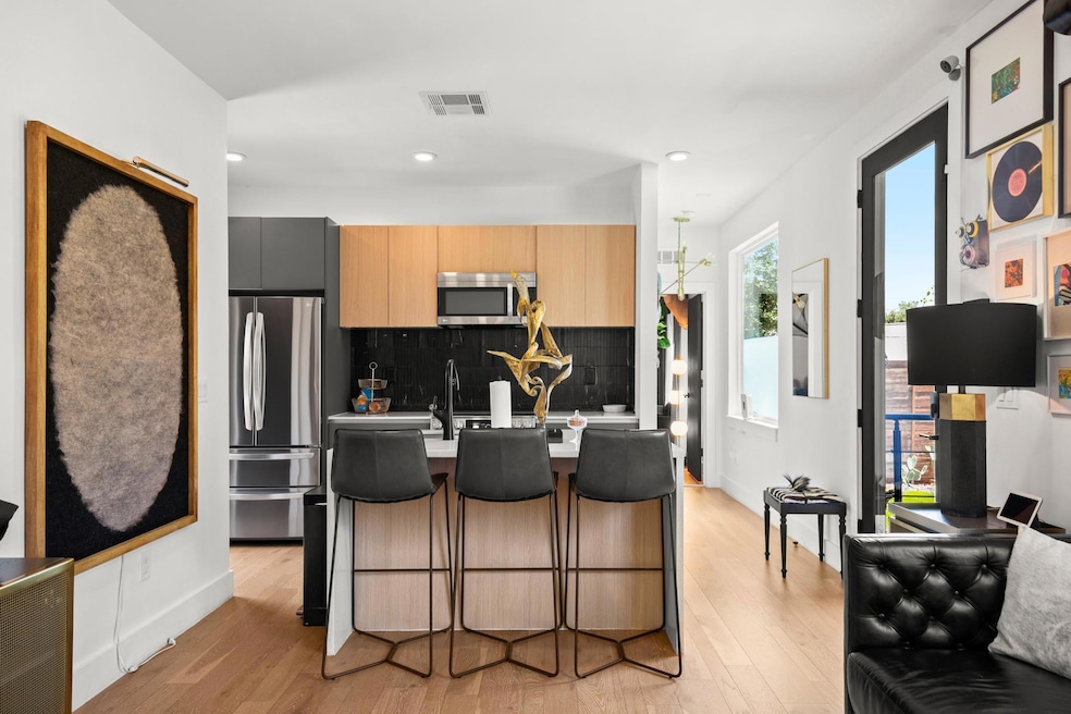 Kitchen featuring appliances with stainless steel