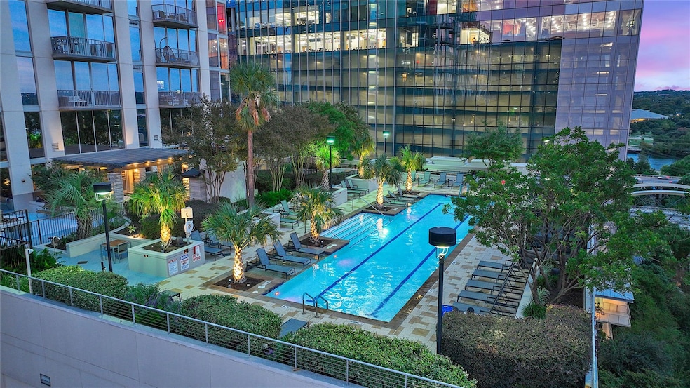 Community pool with a patio