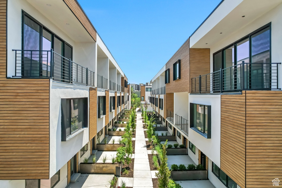 View of home's community with a balcony